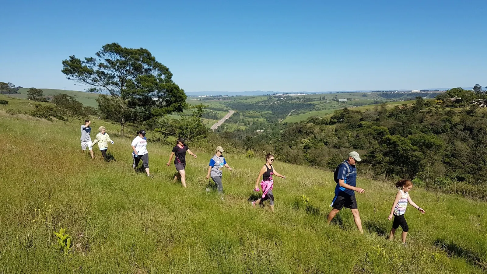 HIKERS ENJOYING THE FRESH CLEAN AIR WITH VIEWS FOREVER
